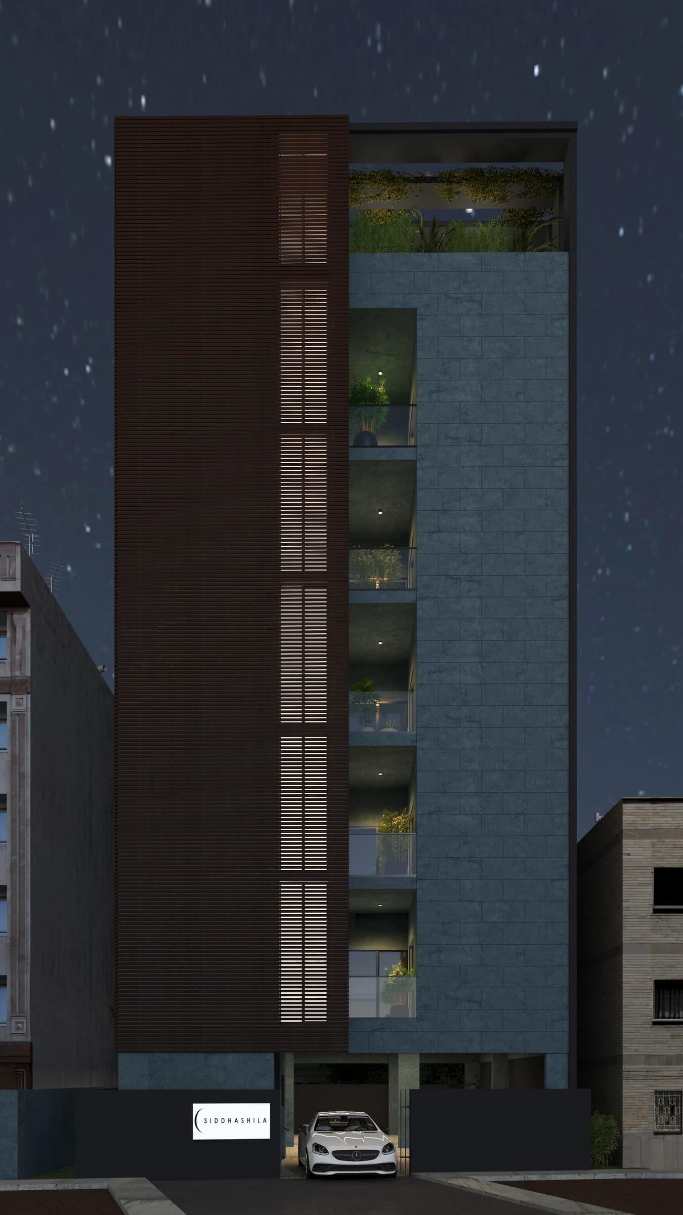 Night exterior view of a tall residential building