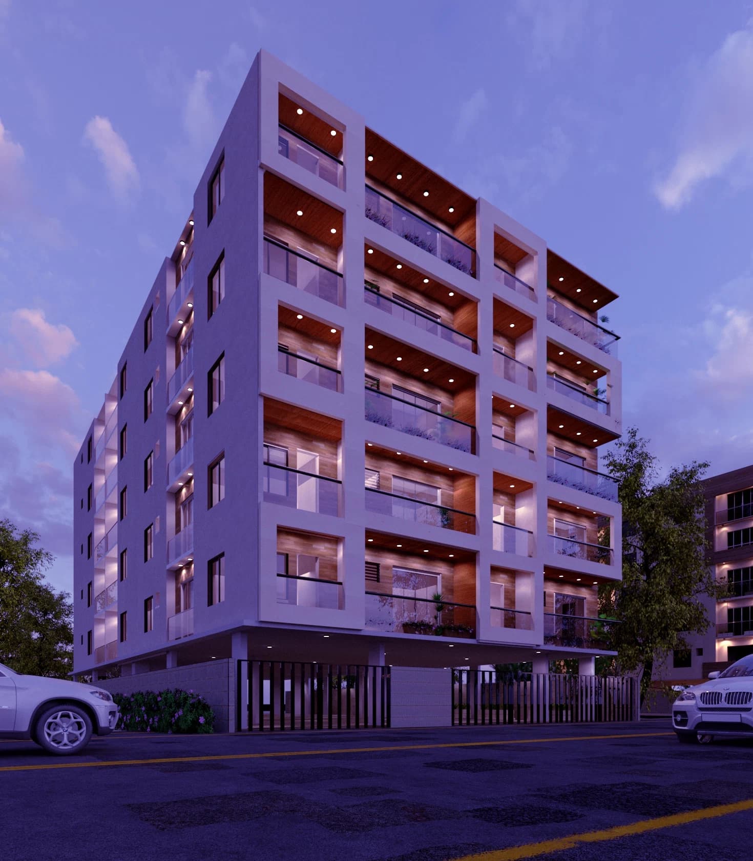 Evening exterior view of a multi-storey residential building