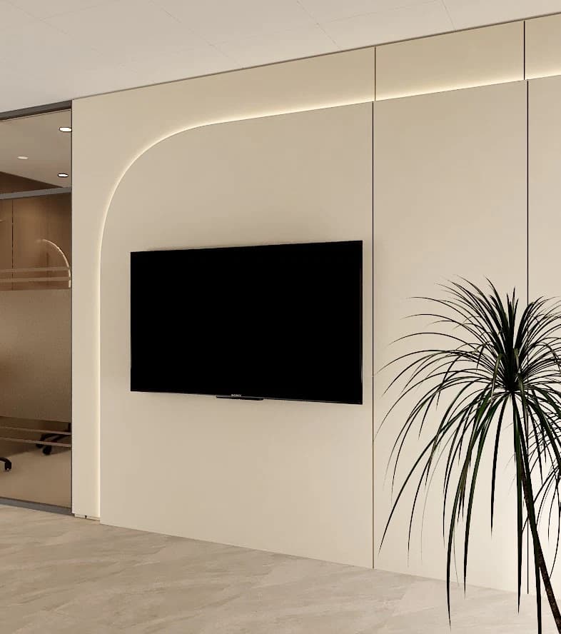 Television wall with curved panel and plant