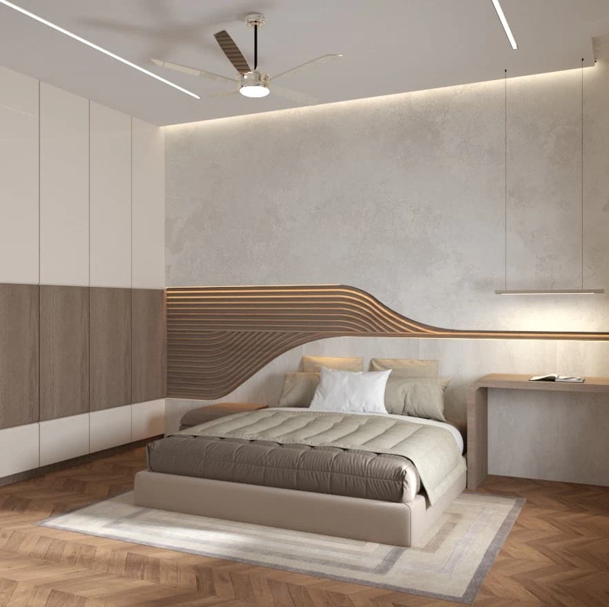 Bedroom with bed and long wardrobe wall