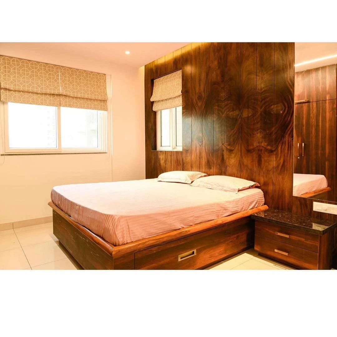 Bedroom with timber wall panels and bed