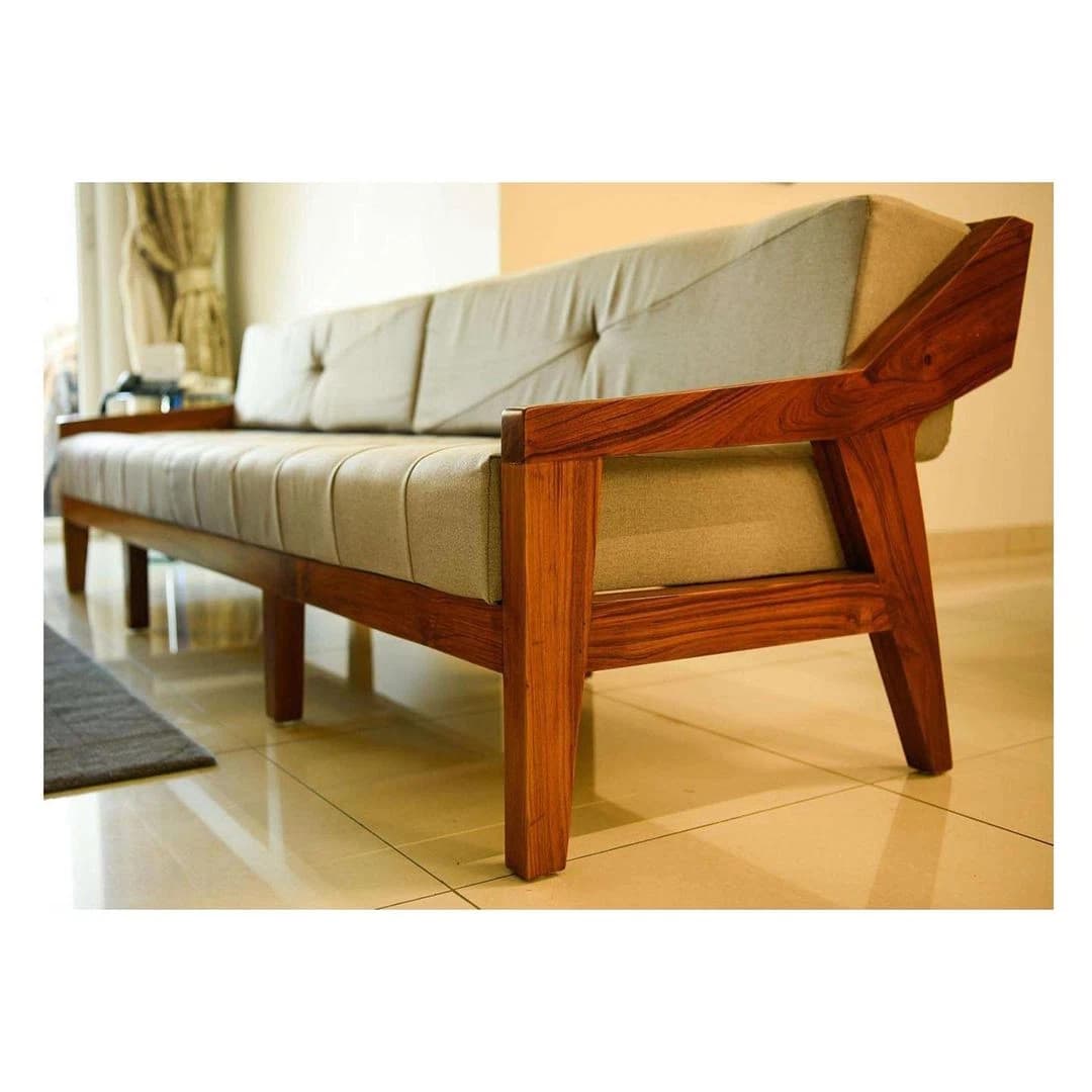 Close view of sofa and timber armrest