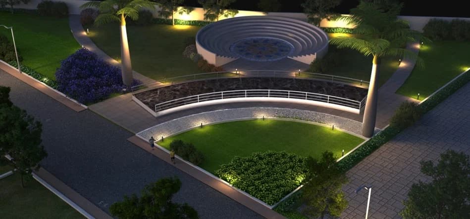 Evening aerial view of a landscaped circular pavilion